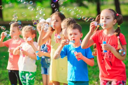 group-children-blowing-soap-bubbles